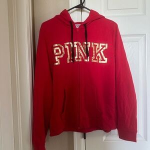 Pink Victoria’s Secret Women zip up hoodie.